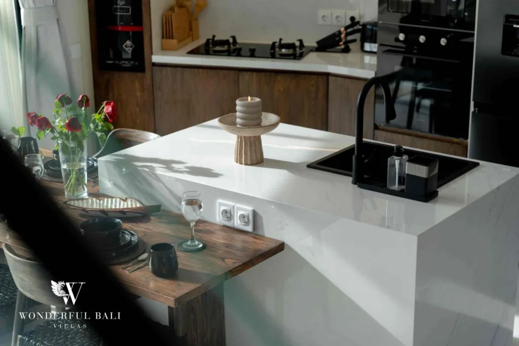 White stone kitchen island with breakfast bar and built-in oven in a 3-bedroom villa near Nusa Dua Bali