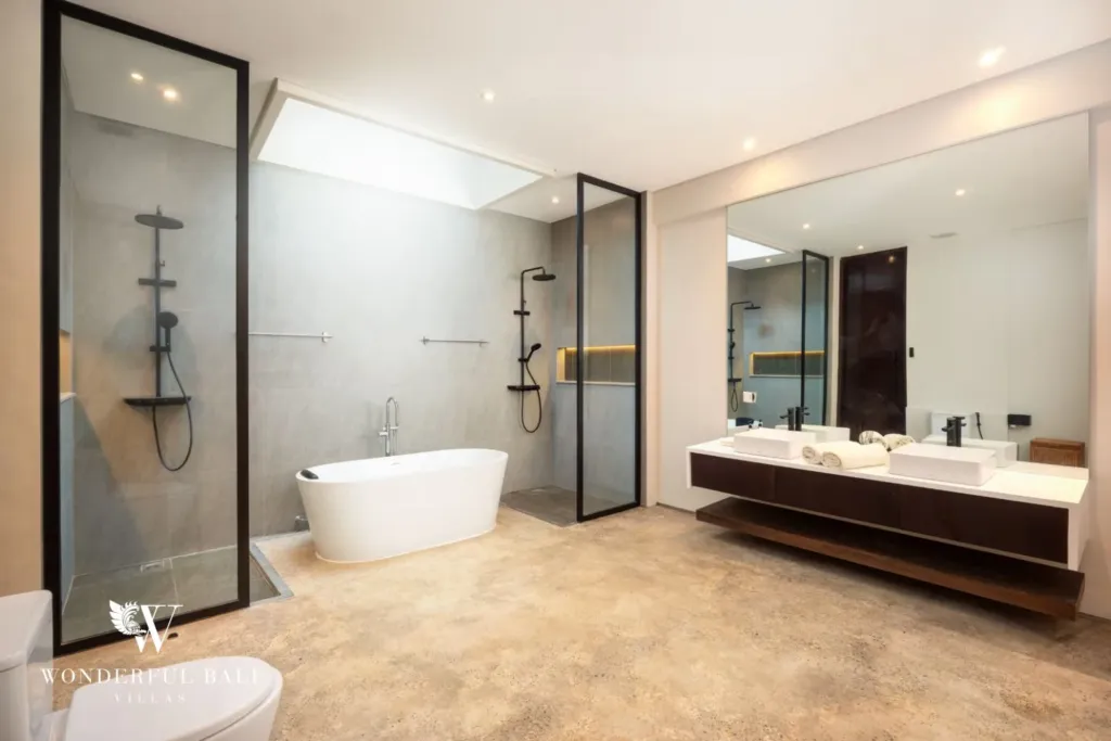 4BR villa for rent in Seminyak — bathroom, freestanding bathtub, twin vanity and walk-in showers