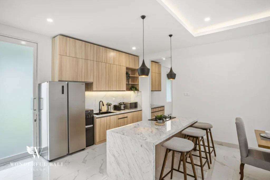 Kitchen breakfast bar with three stools in a 3-bedroom villa in Kaba-Kaba Bali