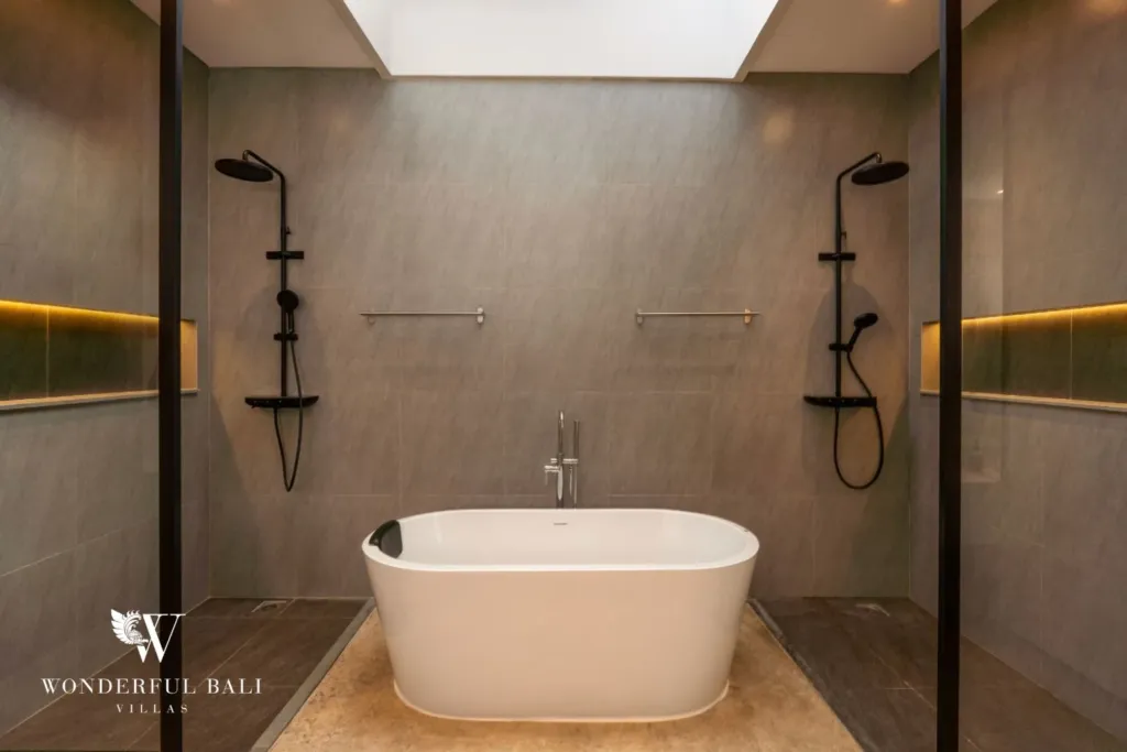 4BR villa for rent in Seminyak — bathroom, bathtub set between two rain showers