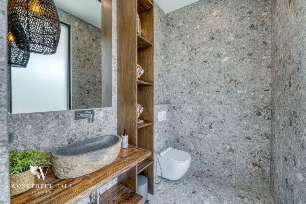 Terrazzo bathroom vanity with a stone vessel basin in a 3-bedroom villa near Nusa Dua Bali