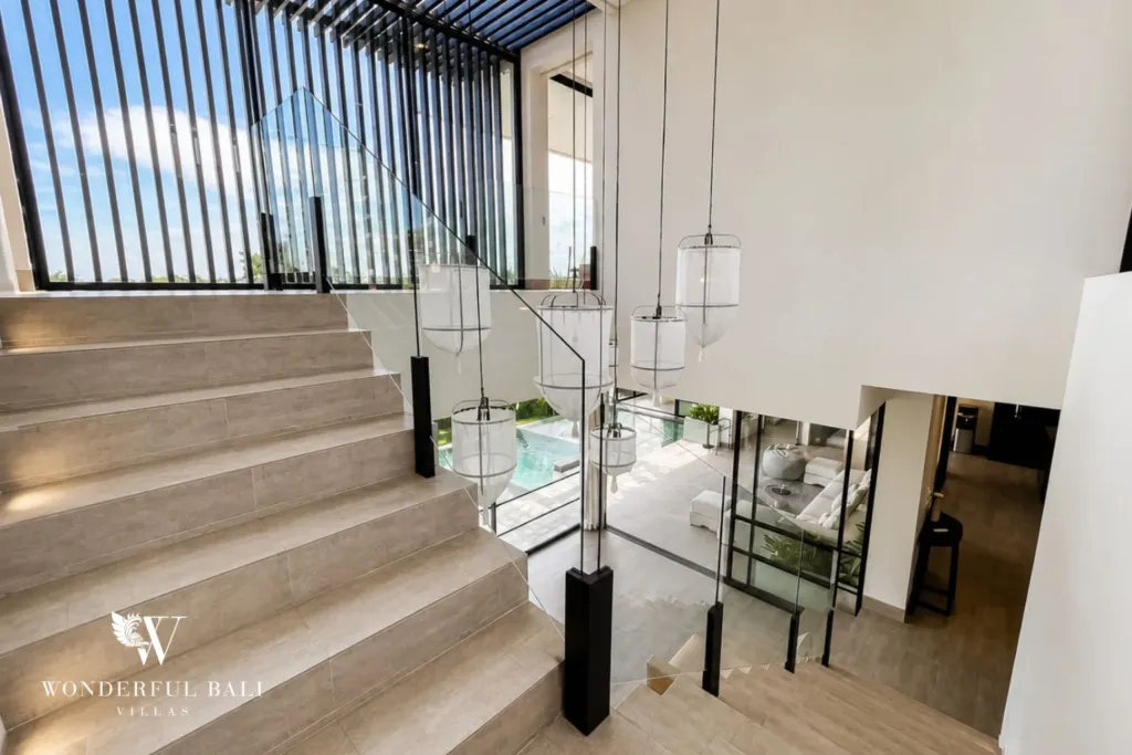 monthly villa rental babakan — open staircase with glass balustrade