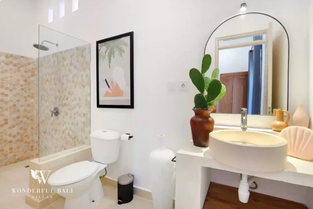 Bathroom with honey hexagon mosaic shower and terrazzo basin in a 3-bedroom villa in Umalas Bali