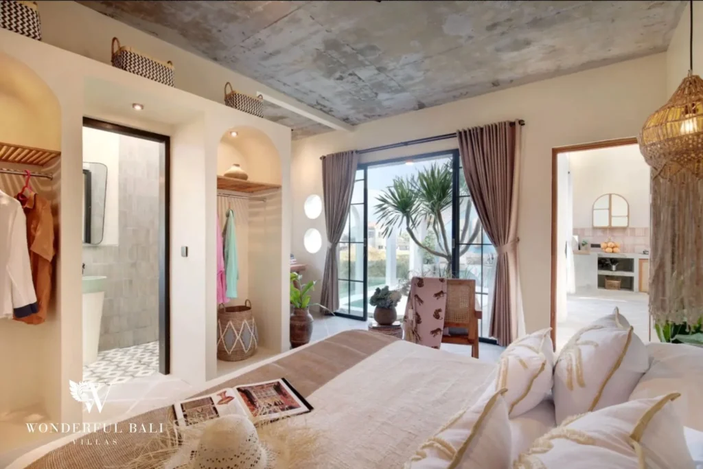 Main bedroom with en-suite and doors onto the pool in a 2-bedroom villa in Buduk Canggu Bali