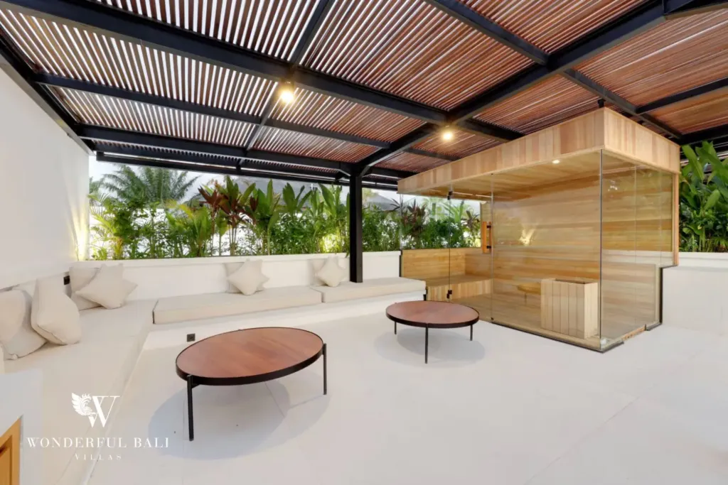 Glass-fronted cedar sauna on the rooftop terrace at a 3BR villa in Pererenan Bali