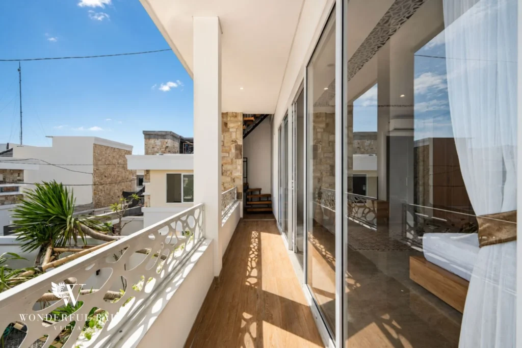 Upper balcony with pierced concrete balustrade at a 3-bedroom villa in Tumbak Bayuh Bali