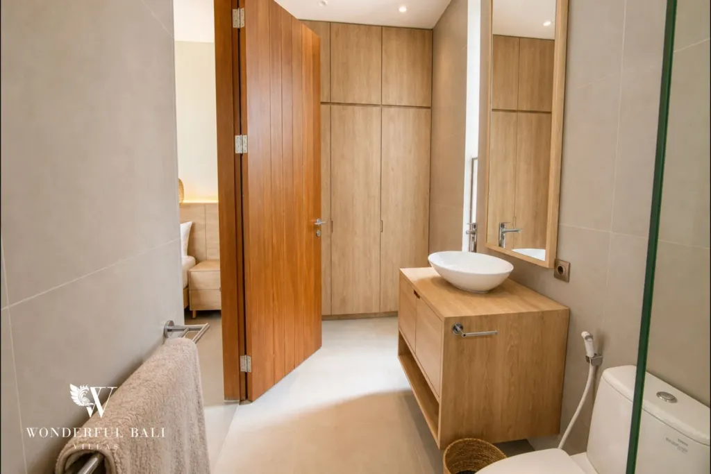 3BR villa for rent in Kedungu — bathroom, vanity and basin beside the wardrobe wall