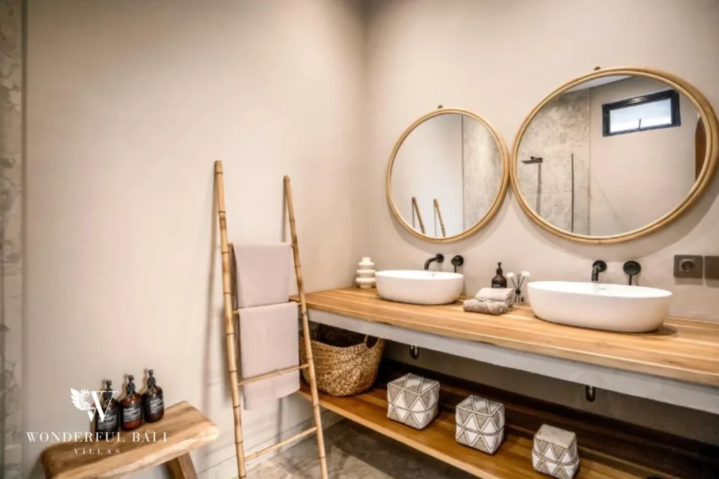 En-suite bathroom with twin vessel basins and round mirrors in Pererenan Bali