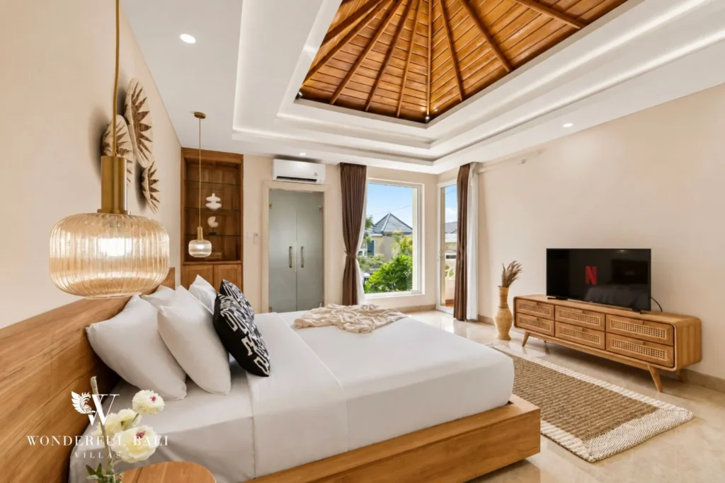 Bedroom under a domed timber ceiling in a 3-bedroom villa in Tumbak Bayuh Bali