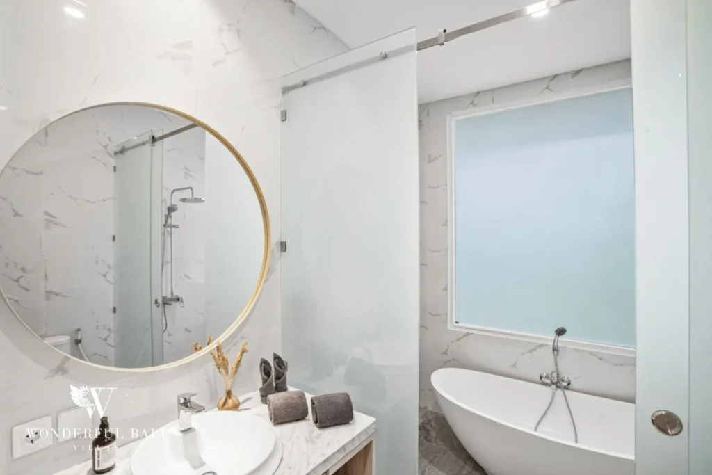 Marble bathroom with freestanding tub and walk-in shower in a 3-bedroom villa in Kaba-Kaba Bali