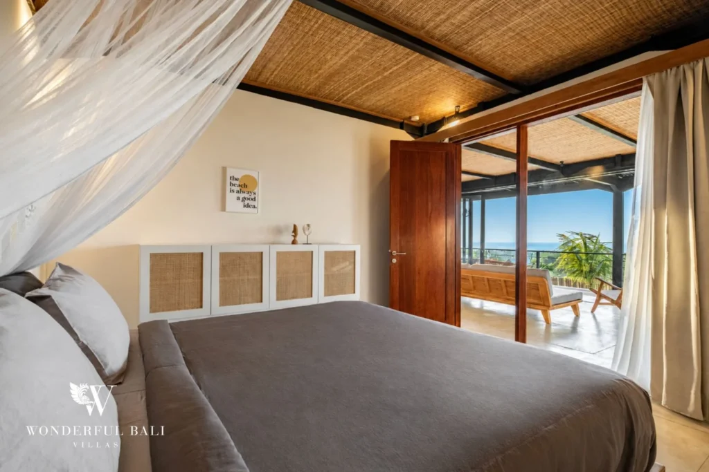 Bedroom opening onto a balcony with sea view in a 5-bedroom villa in Uluwatu Bali