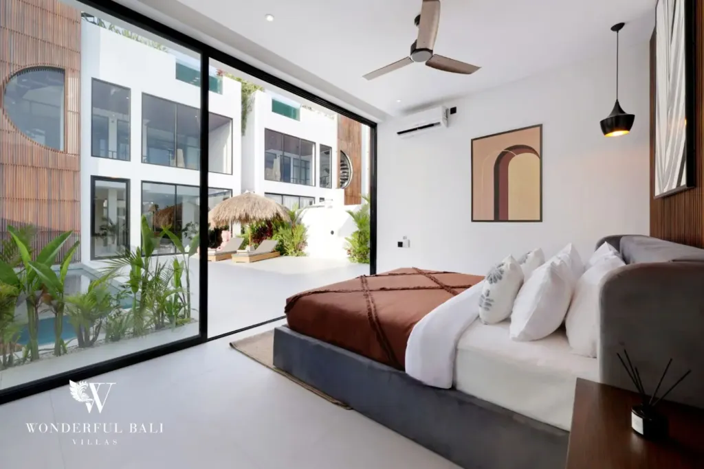 Bedroom opening onto the pool terrace at a 3BR villa in Pererenan Bali
