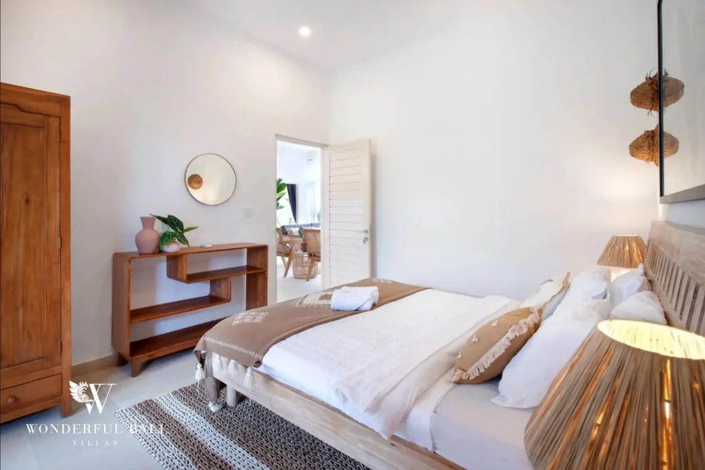 Third bedroom with teak wardrobe and console in a 3-bedroom villa in Umalas Bali