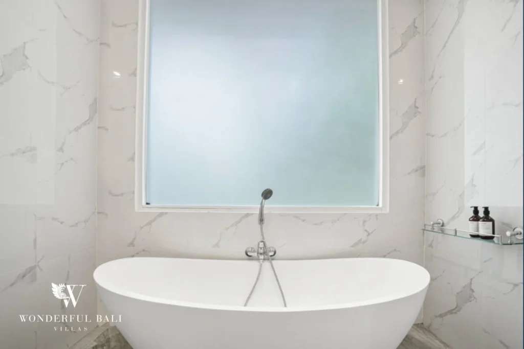 Freestanding soaking tub in book-matched marble at a 3-bedroom villa in Kaba-Kaba Bali