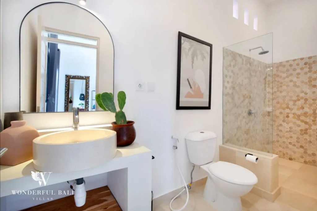 En-suite bathroom with hexagon mosaic shower and terrazzo basin in a 3-bedroom villa in Umalas Bali