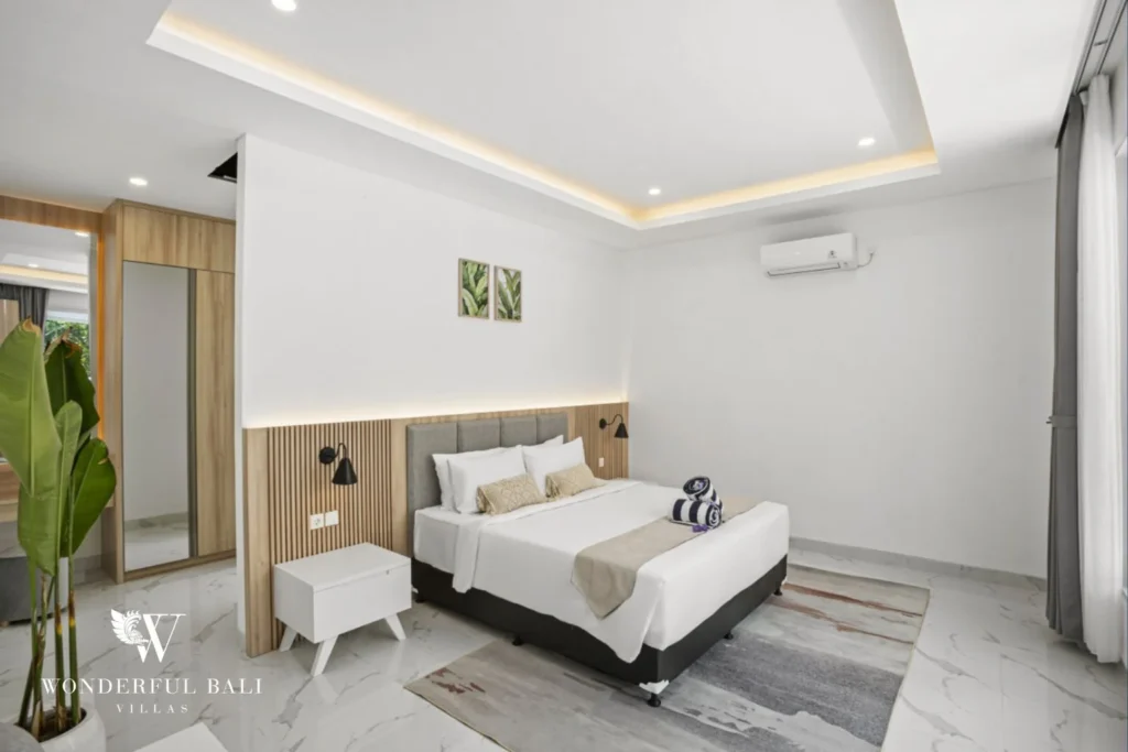 Second bedroom with fluted headboard and mirrored wardrobe in a 3-bedroom villa in Kaba-Kaba Bali