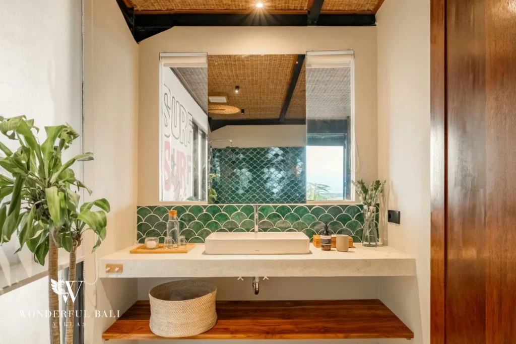 Bathroom with green fish-scale tile and terrazzo vanity in a 5-bedroom villa in Uluwatu Bali