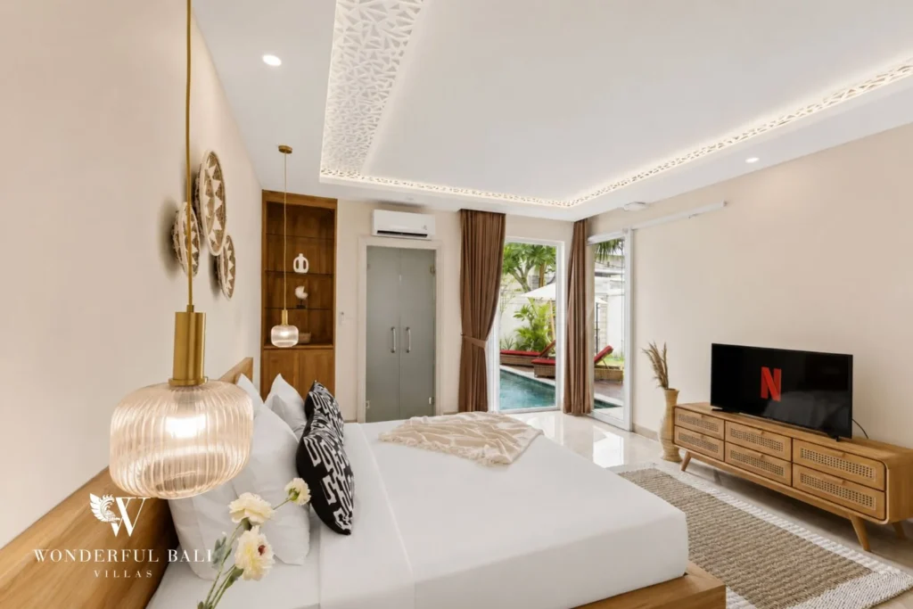 Ground-floor bedroom opening onto the pool in a 3-bedroom villa in Tumbak Bayuh Bali