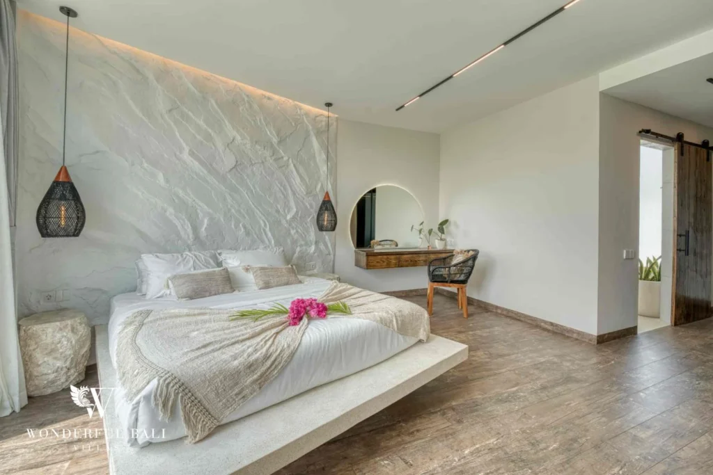 Bedroom with platform bed, arched niche and desk in a 3-bedroom villa near Nusa Dua Bali