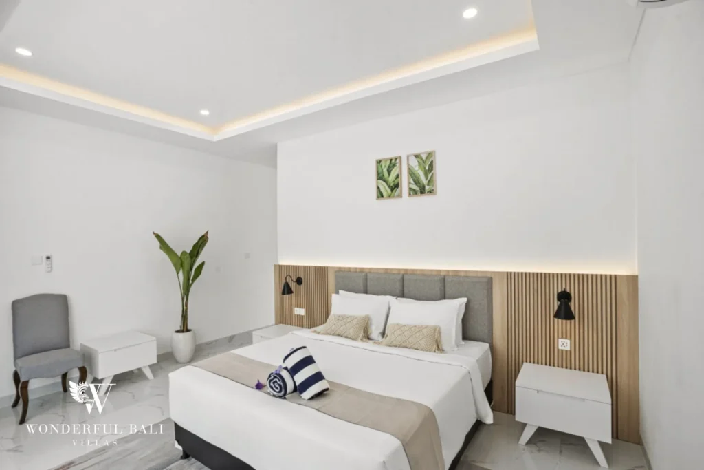 Second bedroom with marble floors and bedside cabinets in a 3-bedroom villa in Kaba-Kaba Bali