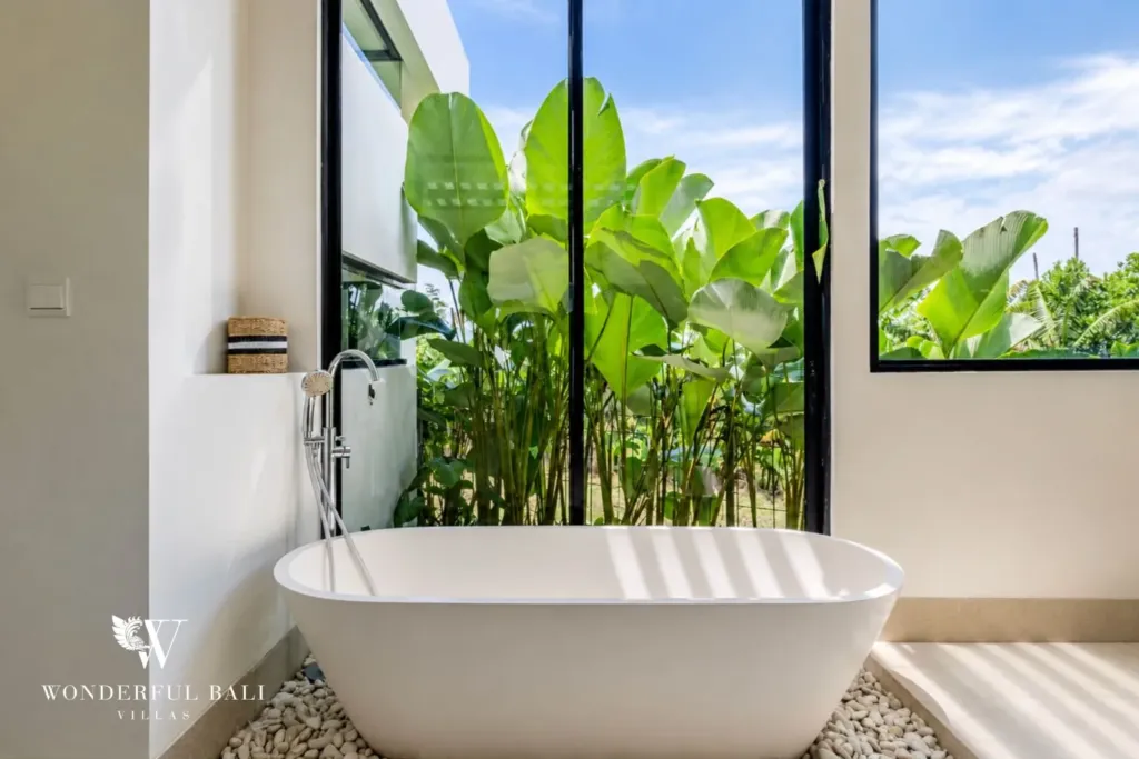 4BR villa for rent in Babakan, Canggu — bathroom, freestanding tub and planted courtyard