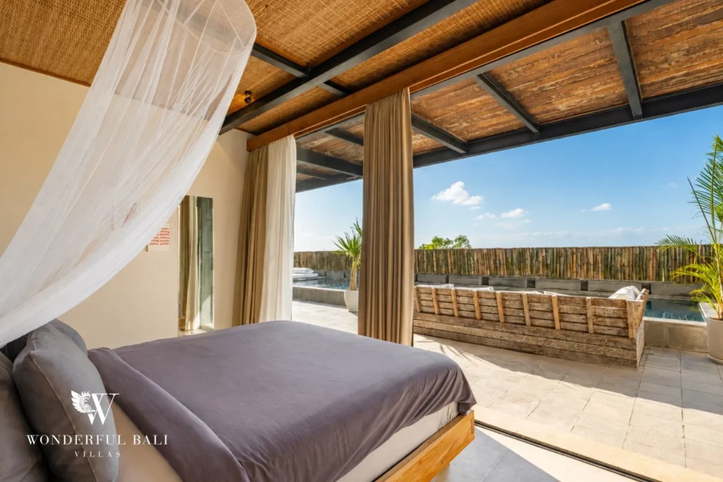 Bedroom opening directly onto the pool deck in a 5-bedroom villa in Uluwatu Bali