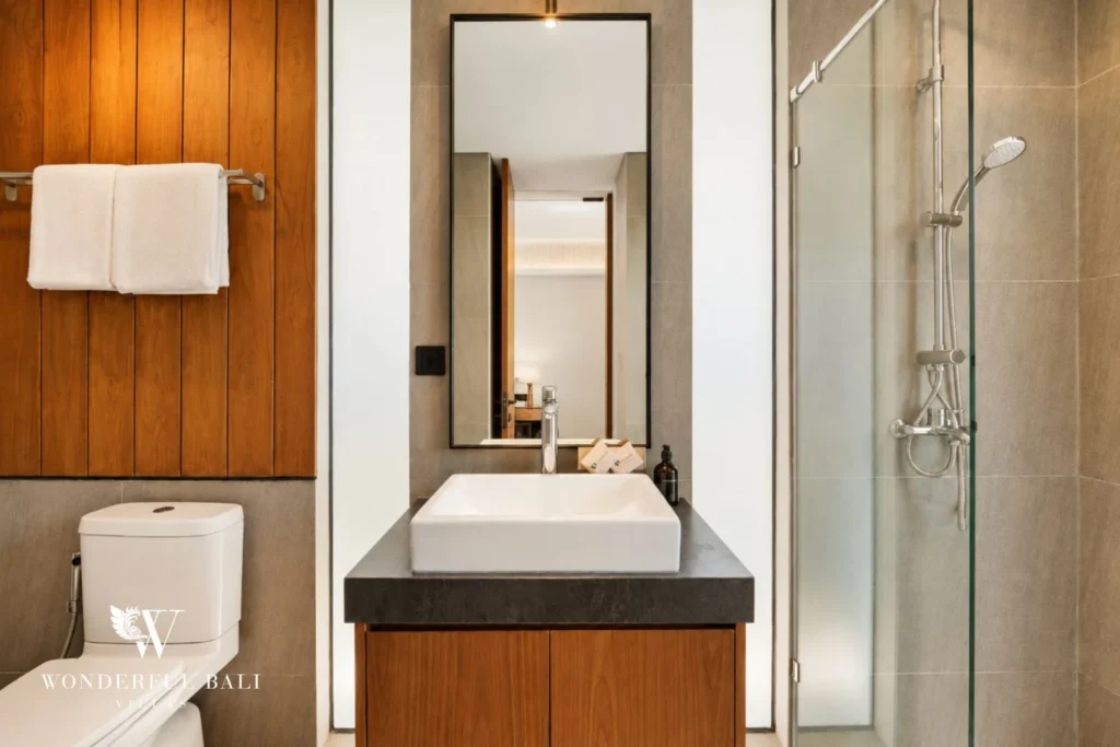 En-suite shower room with oak panelling in a 3-bedroom villa in Jimbaran Bali