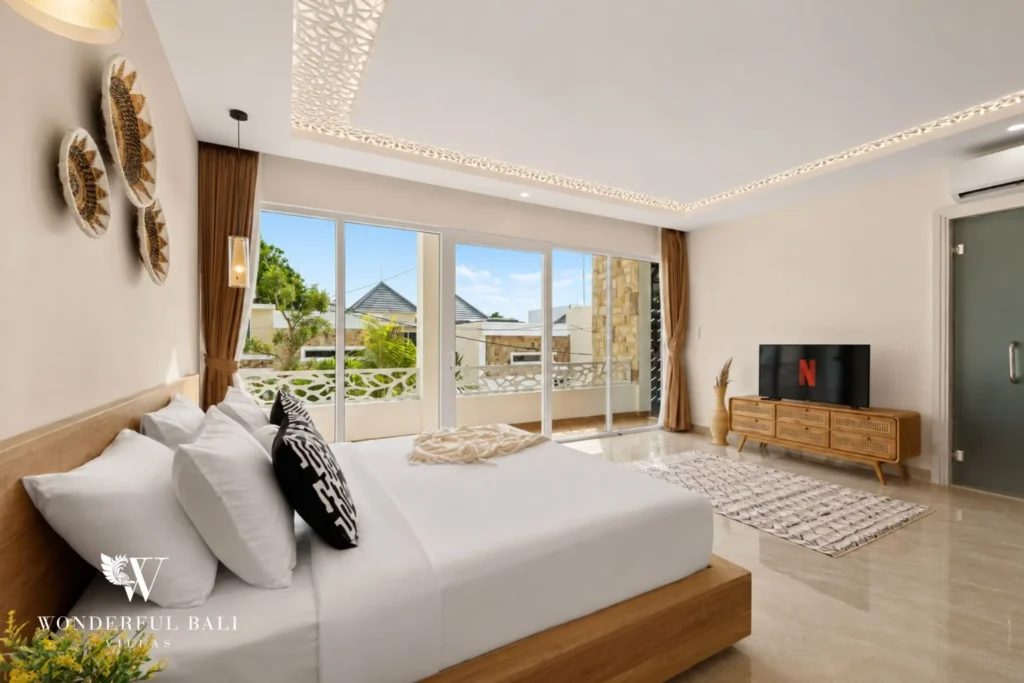 Third bedroom opening onto a private balcony in a 3-bedroom villa in Tumbak Bayuh Bali