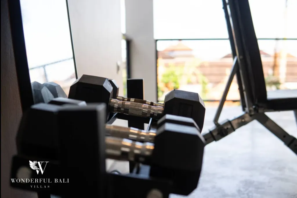 4BR villa for rent in Seminyak — gym, dumbbells and bench in the gym room