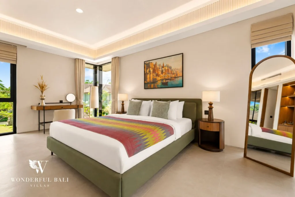 Third bedroom with full-length mirror and garden doors in a 3-bedroom villa in Jimbaran Bali