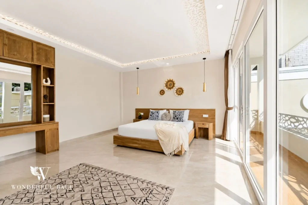 Third bedroom with teak dressing table and mirror in a 3-bedroom villa in Tumbak Bayuh Bali