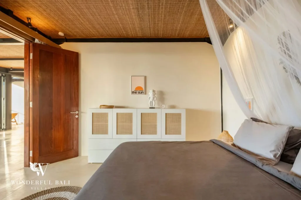 Bedroom with rattan-panelled cabinets in a 5-bedroom villa in Uluwatu Bali