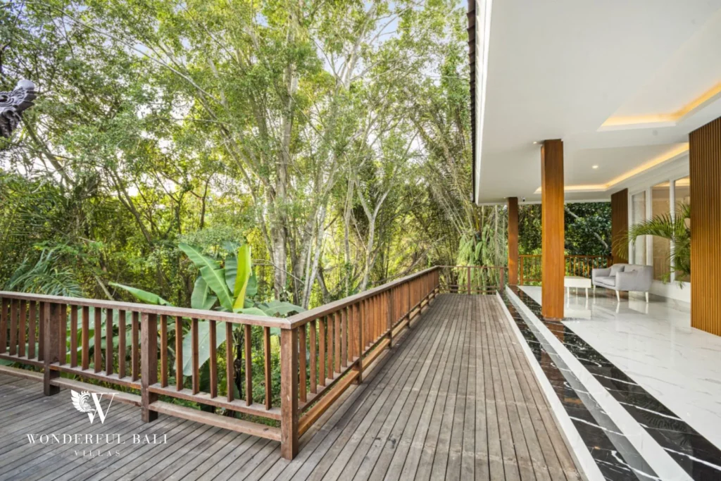 Long timber deck above the valley with a black marble water channel at a 3-bedroom villa in Kaba-Kaba Bali