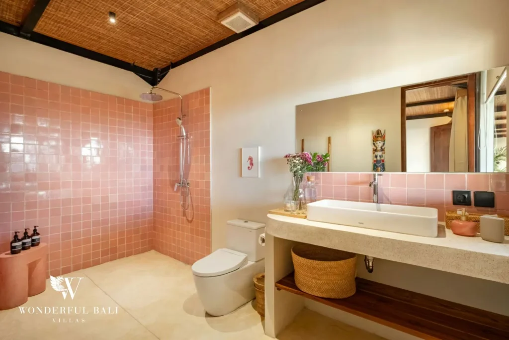 Bathroom in blush pink glazed tile with terrazzo vanity in a 5-bedroom villa in Uluwatu Bali