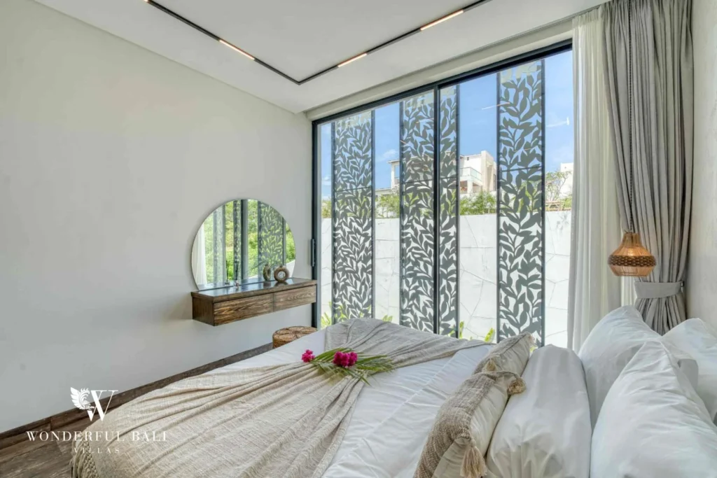 Bedroom with a patterned privacy screen over the window near Nusa Dua Bali