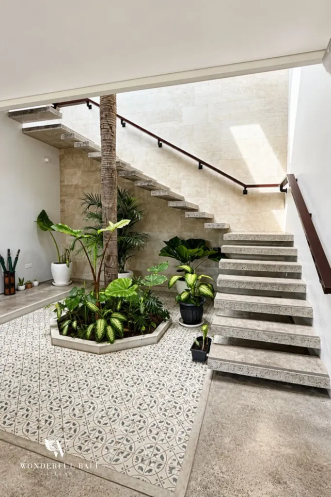 4BR villa for rent in Seminyak — staircase, stair beside a planted internal courtyard