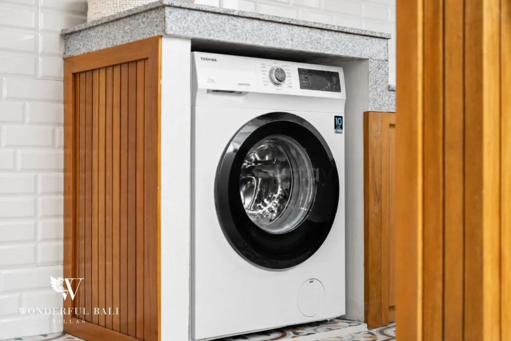 Washing machine built into the rooftop utility counter at a 3-bedroom villa in Tumbak Bayuh Bali