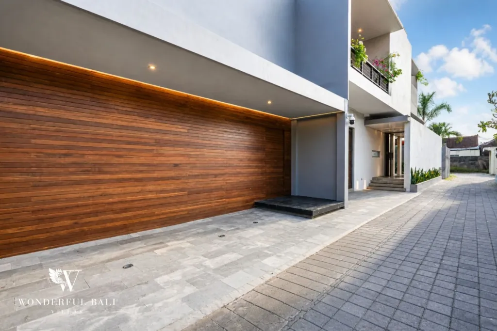 4BR villa for rent in Seminyak — exterior, timber garage door on the driveway