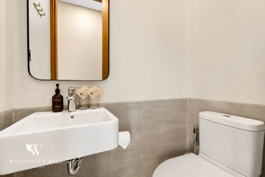 Guest cloakroom with wall-hung basin in a 3-bedroom villa in Jimbaran Bali