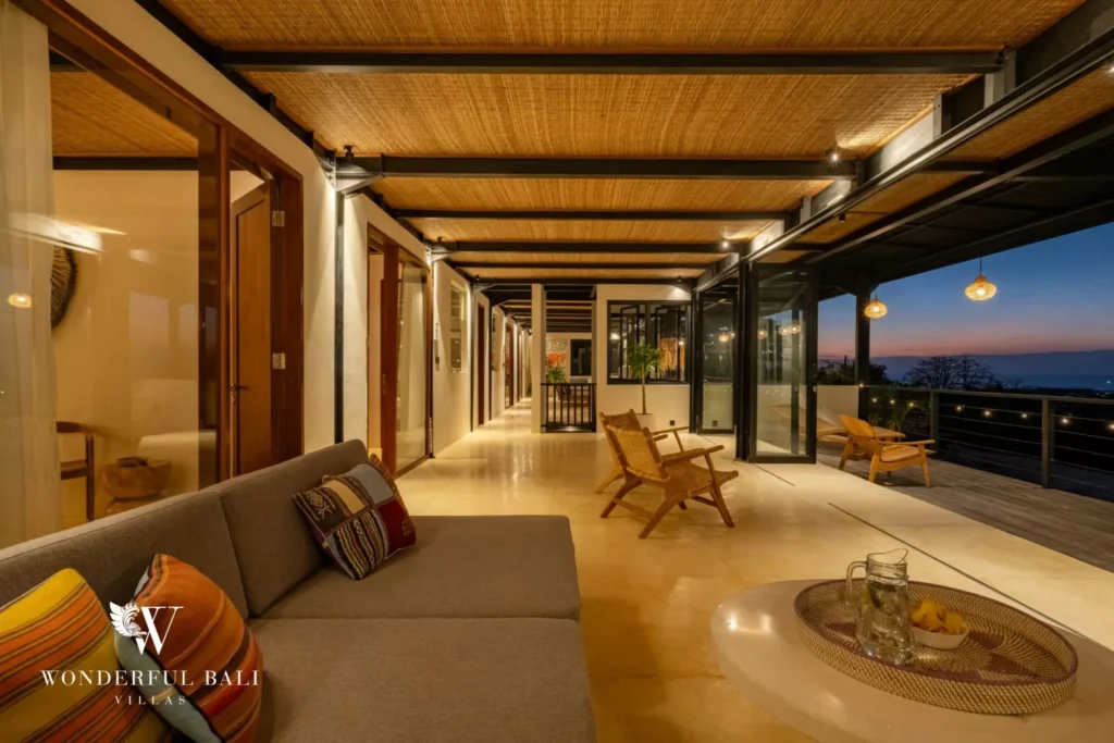 Upper gallery running past the bedrooms at sunset in a 5-bedroom villa in Uluwatu Bali