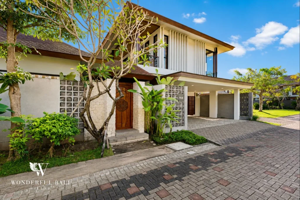 Villa facade and covered parking on a paved lane in Jimbaran Bali