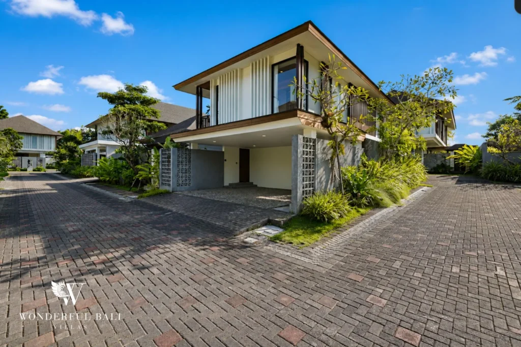 Front of the villa and driveway inside a gated resort community in Jimbaran Bali