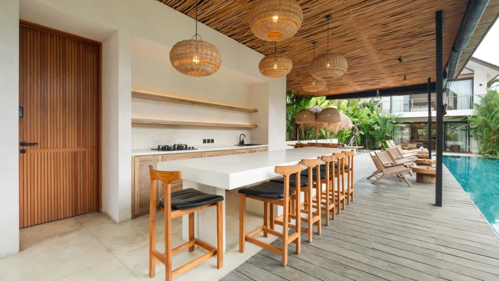 Bar counter with stools beside the pool at Lexington Palace Villa