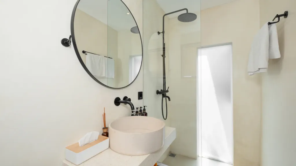 Lexington Palace Villa, Uluwatu — bathroom, en-suite with a round stone basin and rain shower at Lexington Palace Villa