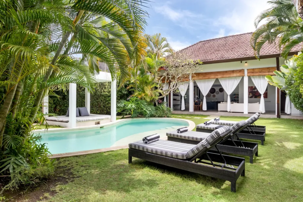 Villa Alice Dua, Seminyak — pool, sun loungers lining the lawn beside the pool at Villa Alice Dua