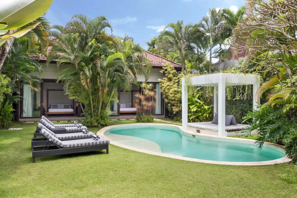 Villa Alice Dua, Seminyak — pool, bean-shaped pool set into the lawn at Villa Alice Dua