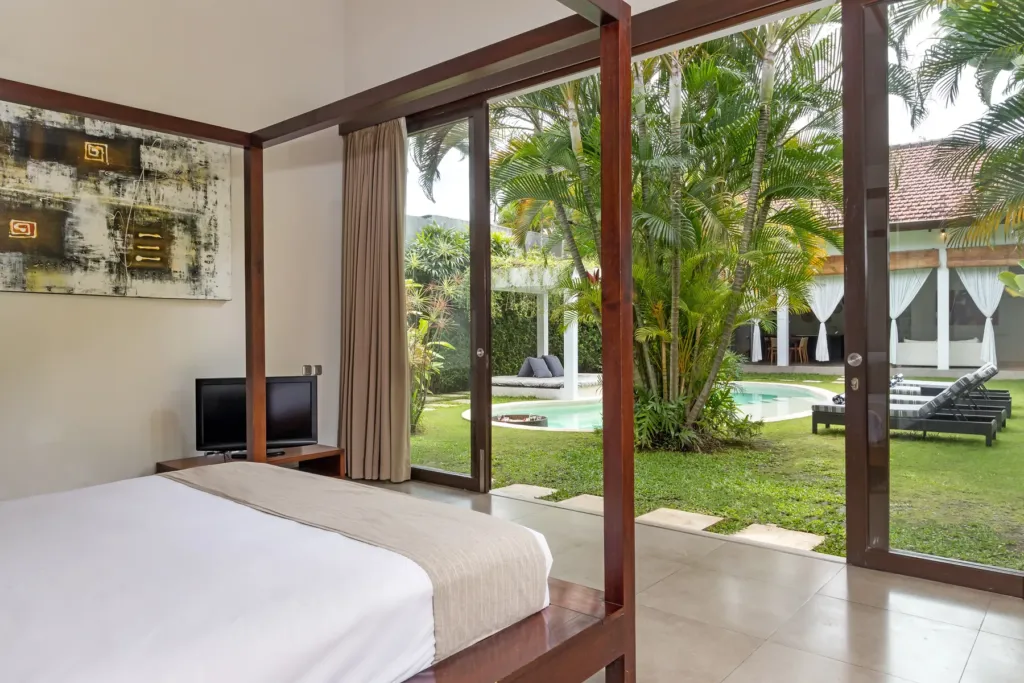 Villa Alice Dua, Seminyak — bedroom, king bedroom with full-height doors onto the garden at Villa Alice Dua