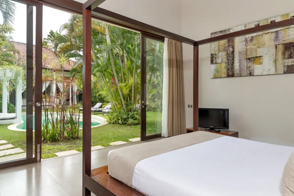Villa Alice Dua, Seminyak — bedroom, second king bedroom with doors onto the garden at Villa Alice Dua