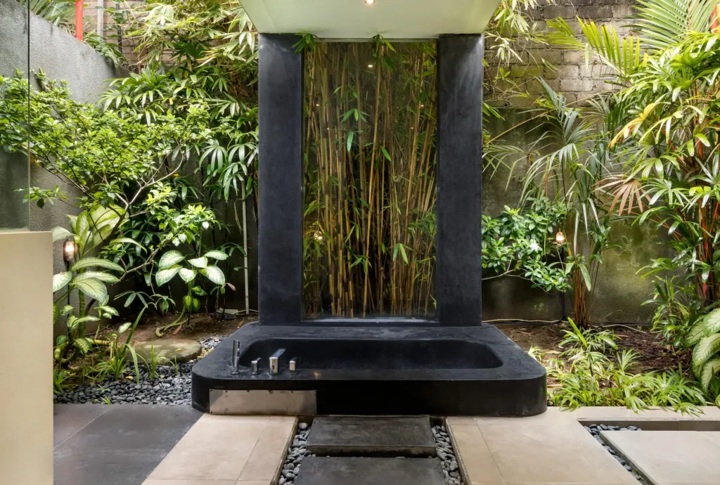 Villa Alice Dua, Seminyak — bathroom, second sunken granite bathtub in a bamboo courtyard at Villa Alice Dua