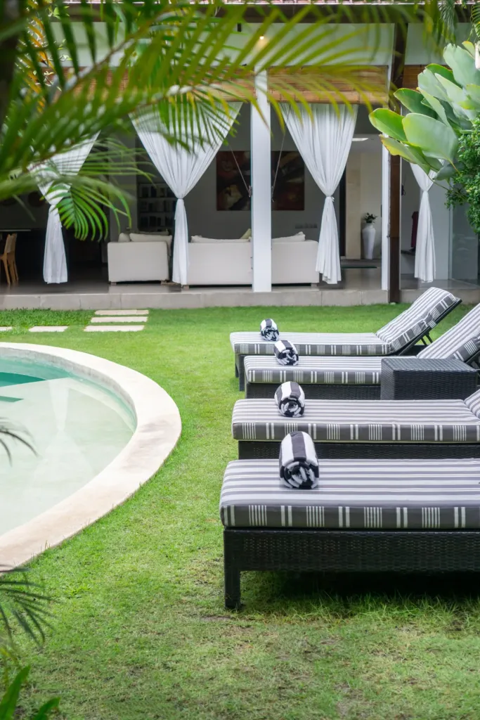 Villa Alice Dua, Seminyak — pool, sun loungers beside the bean-shaped pool at Villa Alice Dua
